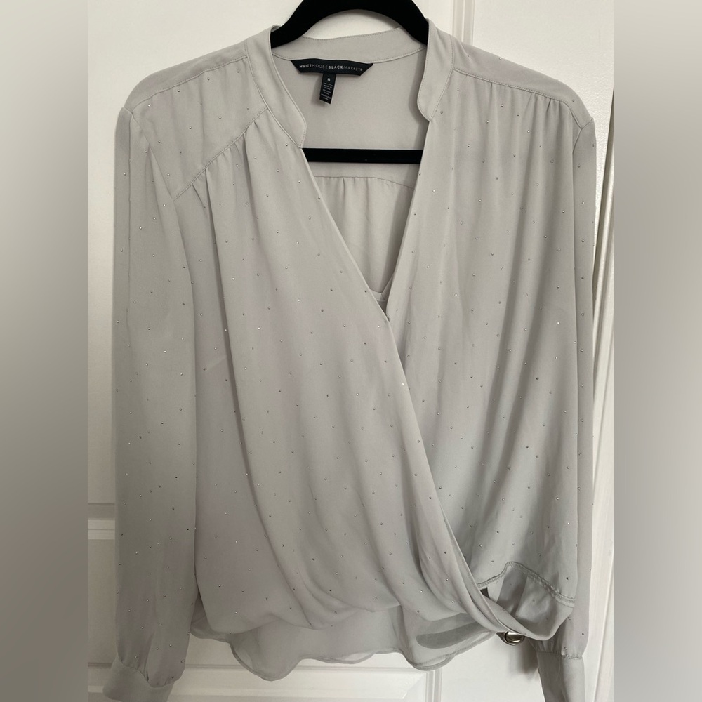 A beautiful pale blue top with tiny silver dots all over.